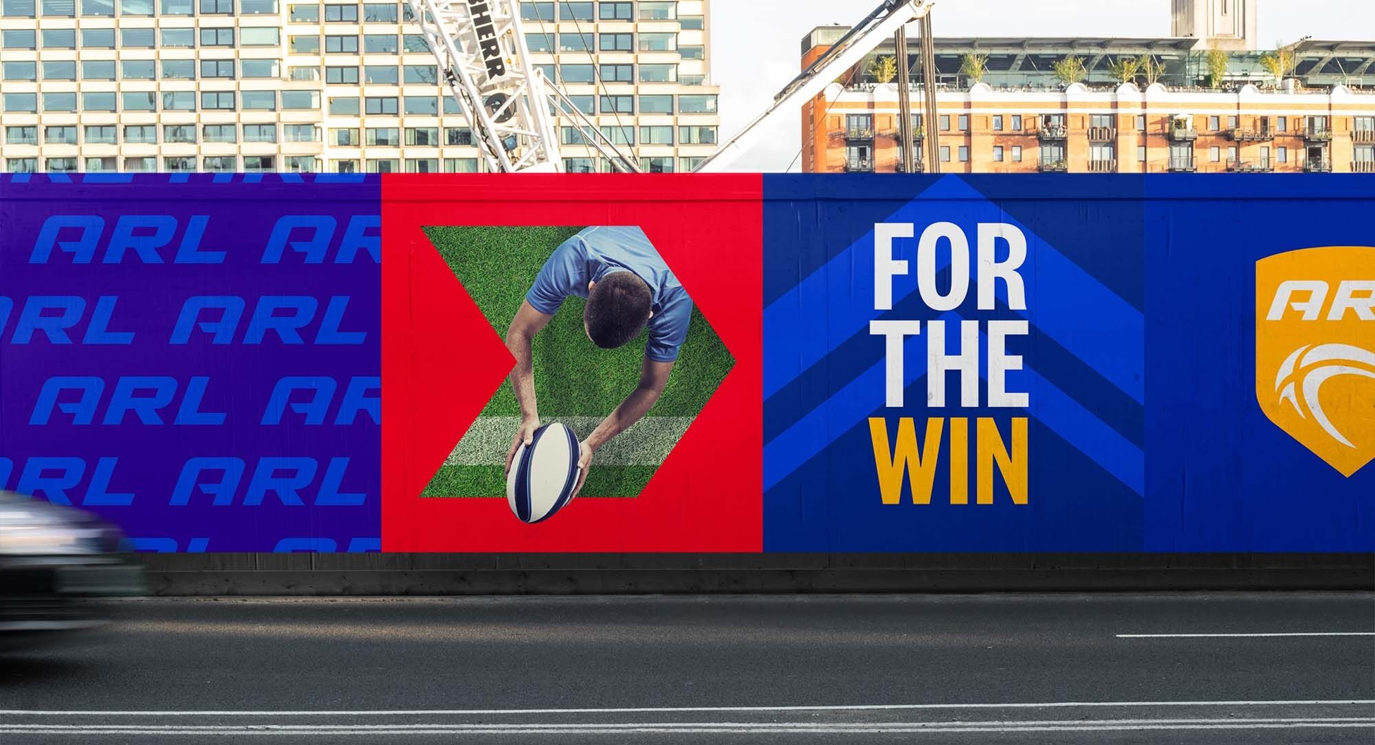 Mock up of the ARL branding displayed as posters on building site wall